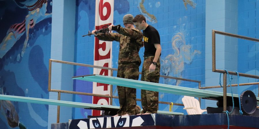 Cadet jumps from 3 meters while blindfolded during the Combat Water Survival Test