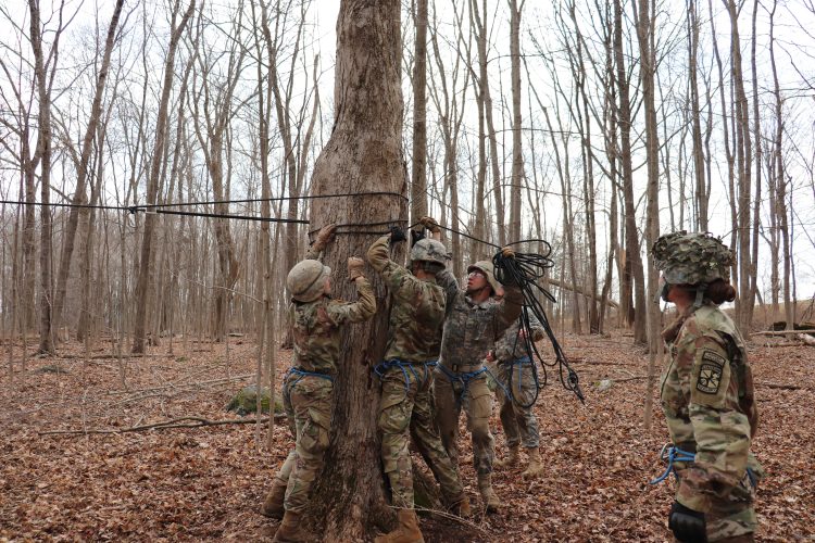 Cadets construct a one-rope bridge