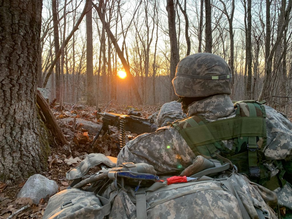 Cadet occupies a security position with an M240B during FTX 2021