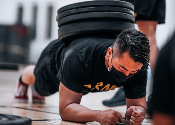 Cadet PT, A cadet is doing a plank with weights on his back