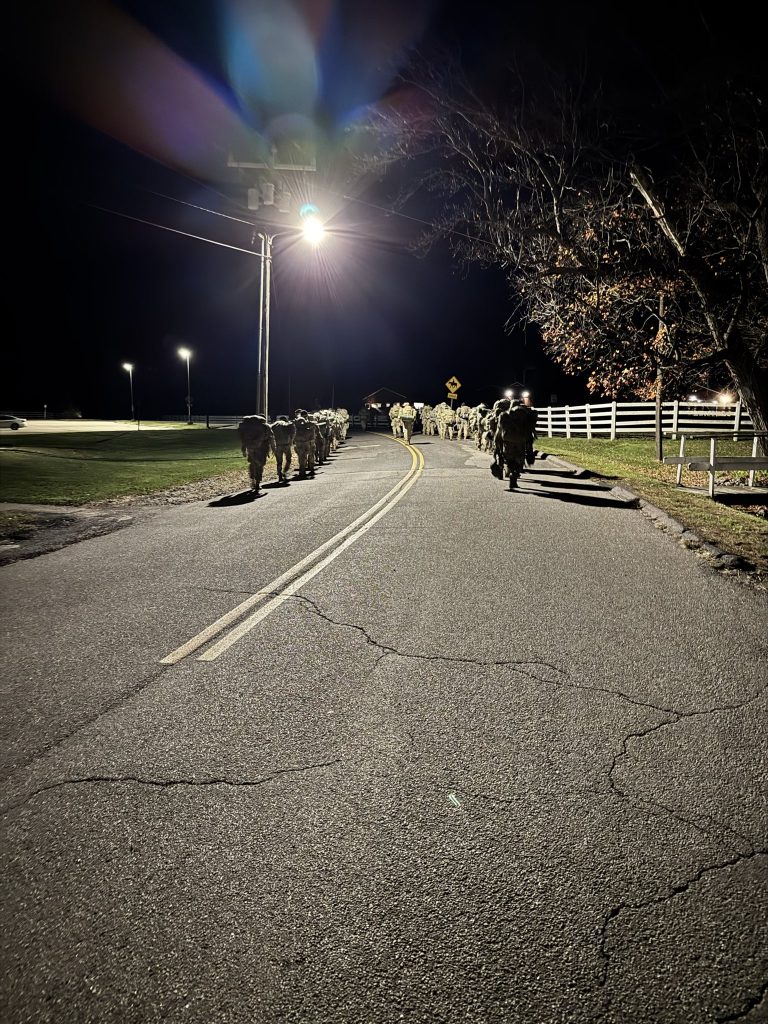 Cadets conduct an early morning ruck march during the fall 2025 FTX at UConn