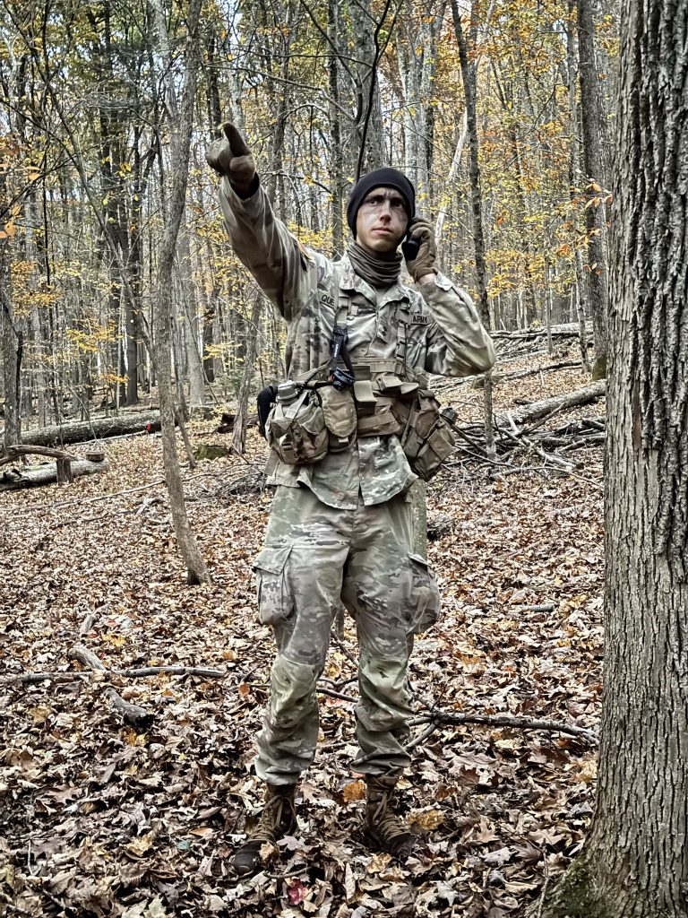 Cadet on radio pointing to where the battalion needs to go